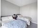 Cozy bedroom features two twin beds with floral bedding and grey headboards at 145 Pier View St # 403, Charleston, SC 29492