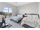Bright bedroom with two beds, balcony, and exercise bike at 145 Pier View St # 403, Charleston, SC 29492