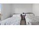Bright bedroom features two twin beds with a connecting red side table at 145 Pier View St # 403, Charleston, SC 29492