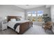 Bedroom featuring large window and a beautifully made bed at 145 Pier View St # 403, Charleston, SC 29492