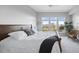 This beautiful bedroom features a ceiling fan, a plant, and a large window at 145 Pier View St # 403, Charleston, SC 29492
