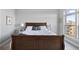 Bedroom with a large bed and a window overlooking a beautiful community at 145 Pier View St # 403, Charleston, SC 29492