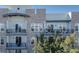 Modern condo featuring private balconies, complemented by lush tree views, creating a serene outdoor space at 145 Pier View St # 403, Charleston, SC 29492