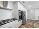 Contemporary kitchen featuring stainless steel appliances, white cabinets, and a modern range hood at 145 Pier View St # 403, Charleston, SC 29492