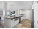 Modern kitchen features white cabinets, granite countertops, stainless steel appliances and a stylish island at 145 Pier View St # 403, Charleston, SC 29492