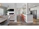 Open-concept living room and kitchen featuring a fireplace and breakfast bar at 145 Pier View St # 403, Charleston, SC 29492