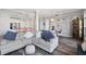 Spacious living room with hardwood floors, an open-concept design, a fireplace, and a kitchen view at 145 Pier View St # 403, Charleston, SC 29492