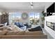 Bright living room with an open floor plan, hardwood floors, and a view of the balcony at 145 Pier View St # 403, Charleston, SC 29492