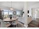 Bright living room with hardwood floors, fireplace, large windows, and an open layout at 145 Pier View St # 403, Charleston, SC 29492