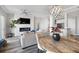 Living room with a fireplace, ceiling fan, modern decor and hardwood floors at 145 Pier View St # 403, Charleston, SC 29492
