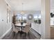 Open-concept living room with a dining area, fireplace, plenty of natural light and stylish decor at 145 Pier View St # 403, Charleston, SC 29492