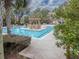 Stunning pool with in-water lounge area and sundeck, surrounded by landscaping, for ultimate relaxation at 145 Pier View St # 403, Charleston, SC 29492