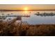 Scenic view of marina at sunrise, offering a serene waterfront lifestyle with boat docks and peaceful waters at 145 Pier View St # 403, Charleston, SC 29492