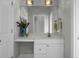 Well-lit bathroom with a vanity with a sink, a decorative mirror, and modern lighting fixtures at 1721 Pimlico Blvd, Moncks Corner, SC 29461