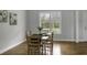 Bright dining area with hardwood floors and a window offering natural light and garden views at 1721 Pimlico Blvd, Moncks Corner, SC 29461