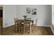 Inviting dining area featuring hardwood floors and an elegant table setting for Gathering meals at 1721 Pimlico Blvd, Moncks Corner, SC 29461