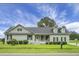 Charming single-story home with inviting porch and well-manicured landscaping on a lush green lawn at 1721 Pimlico Blvd, Moncks Corner, SC 29461