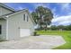 Spacious two-car garage with ample parking area and view of the serene lake at 1721 Pimlico Blvd, Moncks Corner, SC 29461