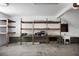 Spacious garage with ample shelving and a utility sink, perfect for storage and projects at 1721 Pimlico Blvd, Moncks Corner, SC 29461