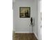 Hallway featuring hardwood floors, modern lighting and a scenic painting at 1721 Pimlico Blvd, Moncks Corner, SC 29461