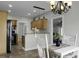 Open concept kitchen with wooden cabinets and peninsula island with dining table at 1721 Pimlico Blvd, Moncks Corner, SC 29461