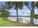 Stunning lake views from a wooden deck under the shade of mature trees, complete with a picnic table at 1721 Pimlico Blvd, Moncks Corner, SC 29461