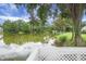 Enjoy tranquil lake views from a deck surrounded by lush greenery, offering a peaceful and scenic retreat at 1721 Pimlico Blvd, Moncks Corner, SC 29461