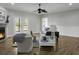 Bright living room featuring hardwood flooring and a classic fireplace at 1721 Pimlico Blvd, Moncks Corner, SC 29461