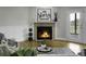 Cozy living room featuring a fireplace and French doors to the back deck at 1721 Pimlico Blvd, Moncks Corner, SC 29461