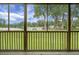 Picturesque screened porch offering serene views of the expansive yard and tranquil lake at 1721 Pimlico Blvd, Moncks Corner, SC 29461
