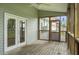 Charming screened porch with access to the yard, complete with a ceiling fan at 1721 Pimlico Blvd, Moncks Corner, SC 29461