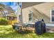 A grill and seating on a grassy backyard lawn at 188 Donning Dr, Summerville, SC 29483