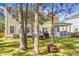 The backyard of this home has a fire pit and screened-in porch at 188 Donning Dr, Summerville, SC 29483