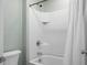 Bathroom showcasing a white-tiled shower-tub combo with modern fixtures and shower curtain at 188 Donning Dr, Summerville, SC 29483