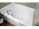 Large white soaking tub with chrome fixtures located adjacent to a glass enclosed shower at 188 Donning Dr, Summerville, SC 29483
