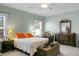 Cozy bedroom featuring two windows, a comfortable bed, dresser, and decorative pillows at 188 Donning Dr, Summerville, SC 29483