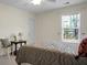 Bedroom with a patterned bed set, ceiling fan and natural light from a window at 188 Donning Dr, Summerville, SC 29483