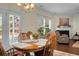 Cozy dining area with fireplace, hardwood floors and natural light at 188 Donning Dr, Summerville, SC 29483