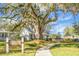 Shady Oak Cottage Coffee House exterior view with a pathway and lush landscaping at 188 Donning Dr, Summerville, SC 29483
