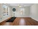 Game room with hardwood floors, large windows, and a dart board setup for entertaining at 188 Donning Dr, Summerville, SC 29483