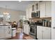 Bright kitchen with white cabinetry, stainless steel appliances, and eat-in area at 188 Donning Dr, Summerville, SC 29483