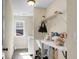 The laundry room features a utility sink, wire shelving and washer hookups at 188 Donning Dr, Summerville, SC 29483