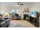Cozy living room featuring a fireplace, ceiling fan, and comfortable seating arrangement at 188 Donning Dr, Summerville, SC 29483