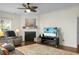 Comfortable living area with a fireplace, stylish rug, and modern entertainment center at 188 Donning Dr, Summerville, SC 29483