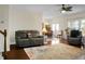 Spacious living area with hardwood floors, comfortable seating, and views into the dining room at 188 Donning Dr, Summerville, SC 29483