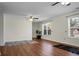 Spacious living room with hardwood floors, ceiling fan, and large windows offering natural light at 188 Donning Dr, Summerville, SC 29483