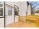 Low angle view of the home's back deck with a rear entry door on a sunny day at 2191 Helm Ave, North Charleston, SC 29405