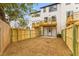 Backyard area with privacy fence features natural ground cover and access to a small deck at 2191 Helm Ave, North Charleston, SC 29405