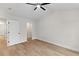 Bedroom featuring hardwood floors, white walls and trim, and a doorway to a walk-in closet at 2191 Helm Ave, North Charleston, SC 29405