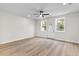 Bright bedroom with hardwood floors, ample natural light, and a ceiling fan at 2191 Helm Ave, North Charleston, SC 29405